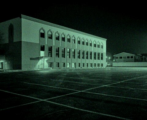 dvrbridge DVR channel 2 — night CCTV camera view of a car park